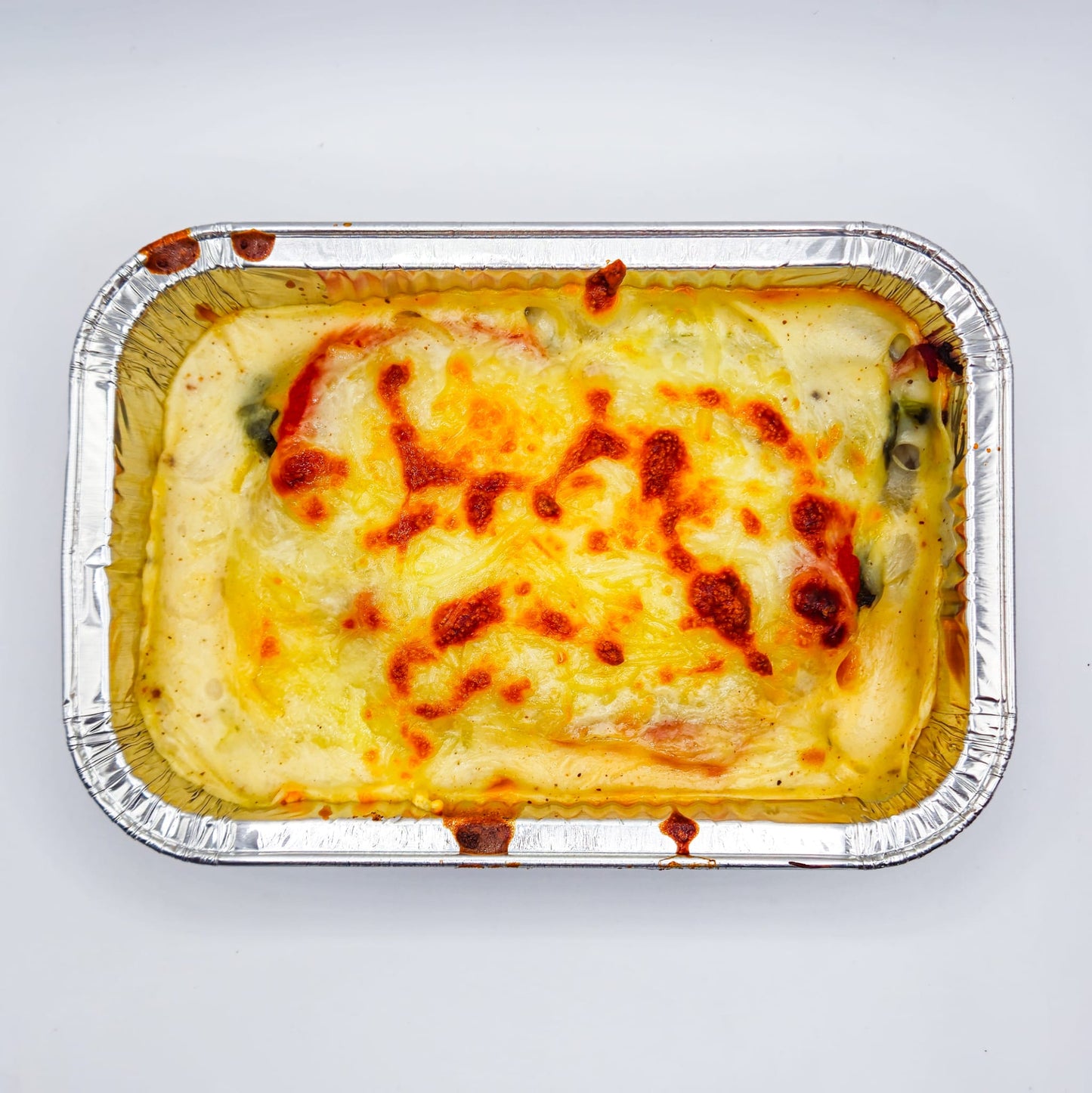 CANELONS D'ESPINACS AMB BEIXAMEL I SALSA DE TOMATA